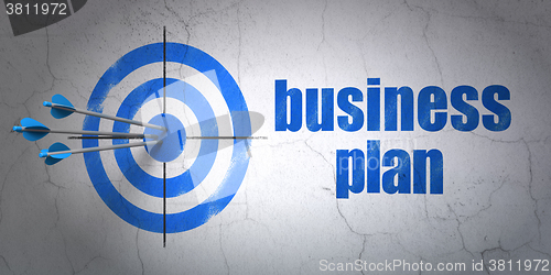 Image of Business concept: target and Business Plan on wall background