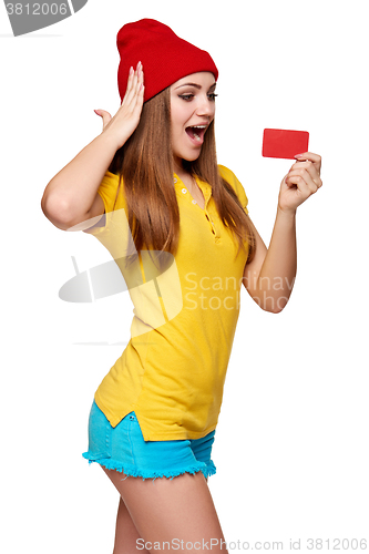 Image of Surprised teen funky girl with credit card