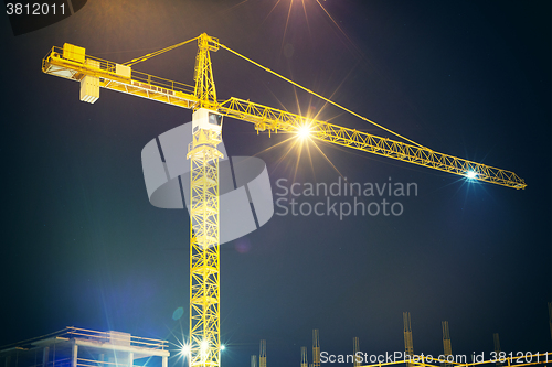 Image of crane and illumination at night