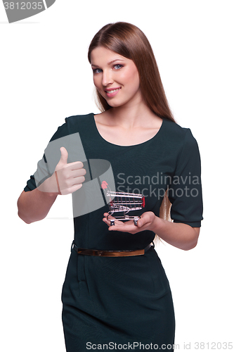 Image of Woman holding small empty shopping cart