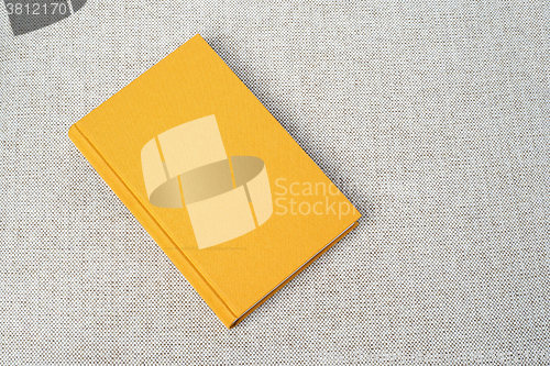 Image of Yellow book on the table