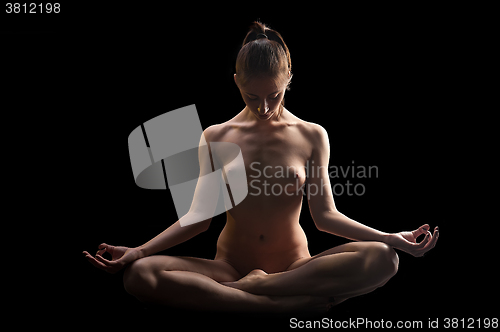 Image of attractive naked woman in zen position