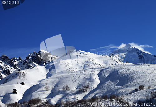 Image of Mount Tetnuldi and off-piste slope with track from ski and snowb