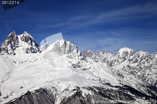 Image of Mount Ushba in winter at wind sunny day