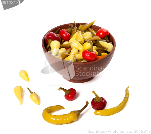 Image of Mix of hot turkish marinated peppers in ceramic bowl