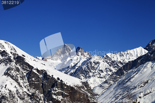 Image of Mountain peaks in winter at sunny day