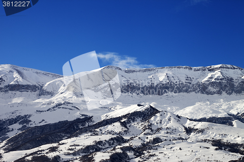 Image of Snowy mountains and blue sky at nice sun day