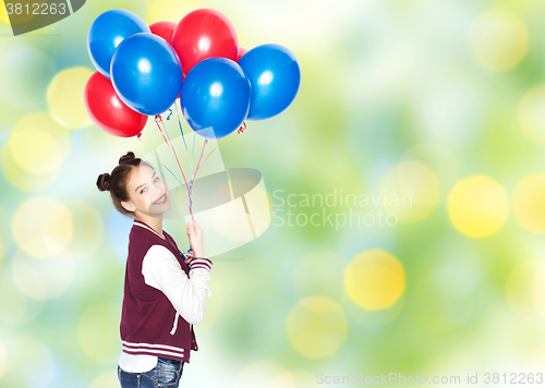 Image of happy teenage girl with helium balloons