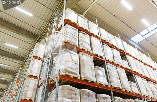 Image of cargo boxes storing at warehouse shelves