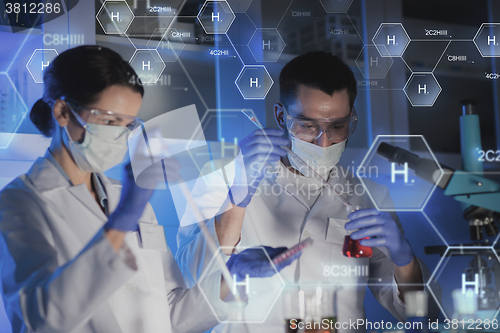 Image of close up of scientists making test in lab