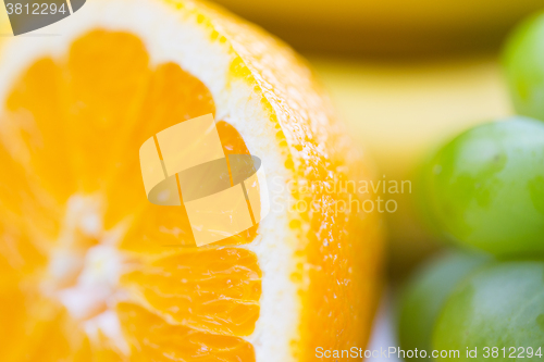 Image of close up of fresh juicy orange and grape