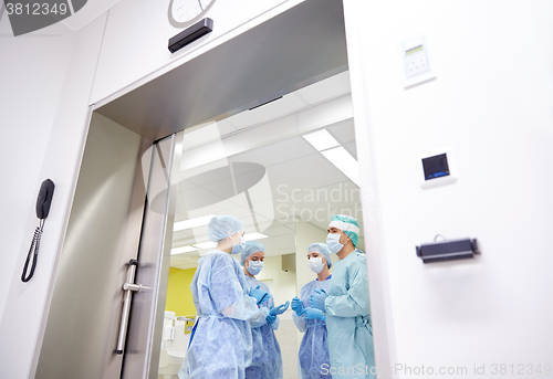 Image of group of surgeons in operating room at hospital