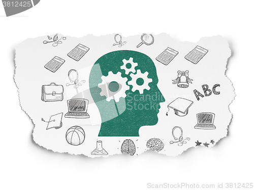 Image of Education concept: Head With Gears on Torn Paper background