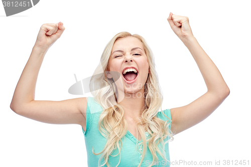 Image of happy young woman or teen girl celebrating victory