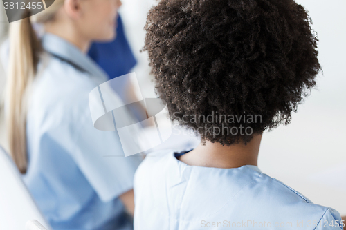 Image of close up of african doctor at hospital from back