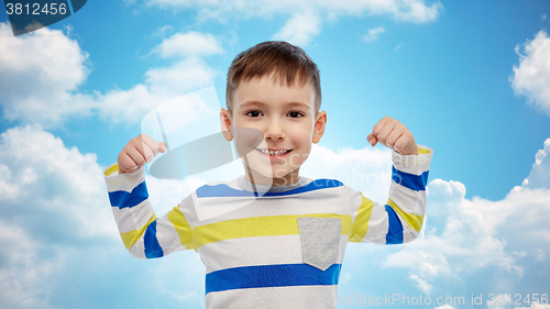 Image of happy smiling little boy with raised hand