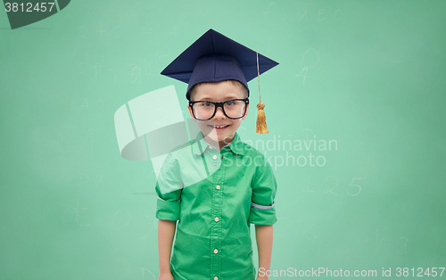 Image of happy boy in bachelor hat or mortarboard