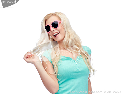 Image of happy young blonde woman or teenager in sunglasses