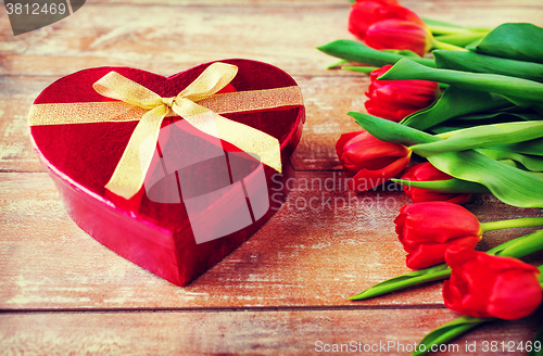 Image of close up of red tulips and chocolate box