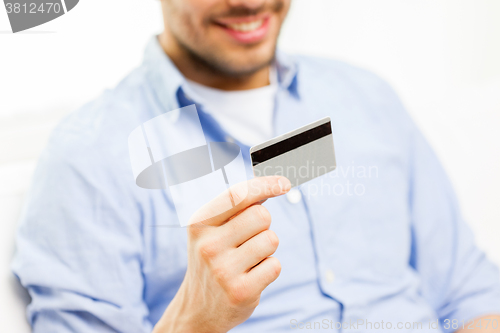 Image of close up of man with credit card