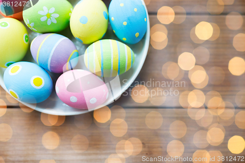 Image of close up of colored easter eggs on plate