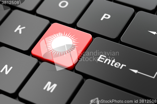 Image of Tourism concept: Sun on computer keyboard background