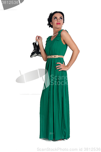 Image of Pretty young woman in long green dress