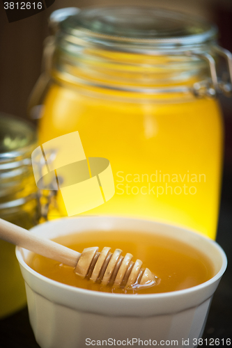Image of Honey with wooden spoon