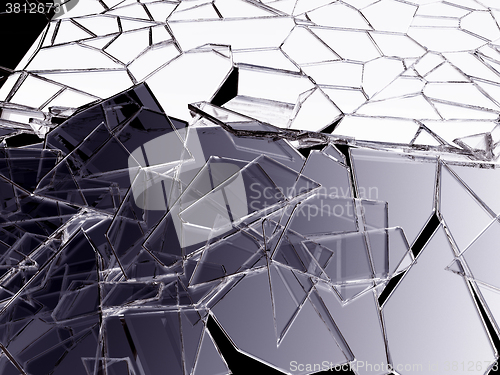 Image of Pieces of splitted or cracked glass on black