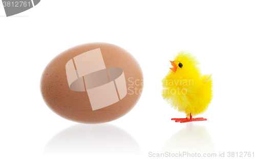 Image of Easter chicks surrounding a large egg