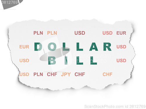 Image of Money concept: Dollar Bill on Torn Paper background