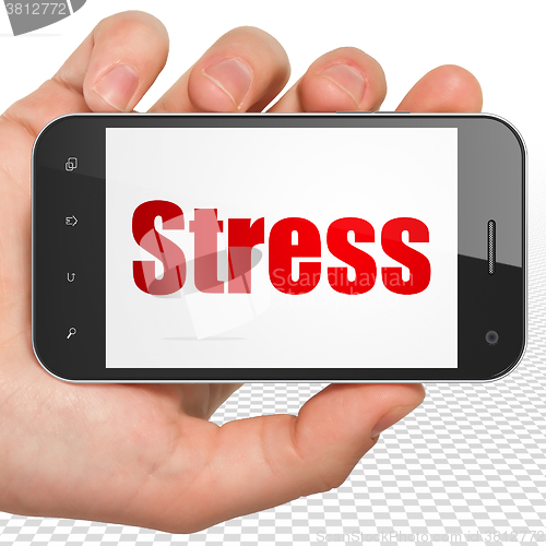 Image of Medicine concept: Hand Holding Smartphone with Stress on display