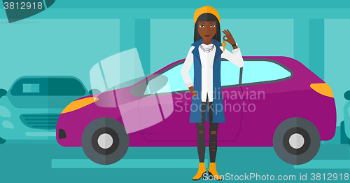 Image of Woman holding keys from new car.