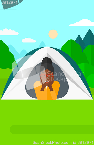 Image of Woman lying in tent.