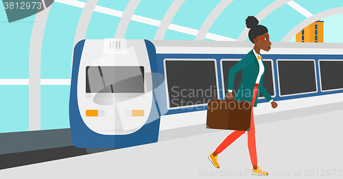 Image of Woman going out of train.