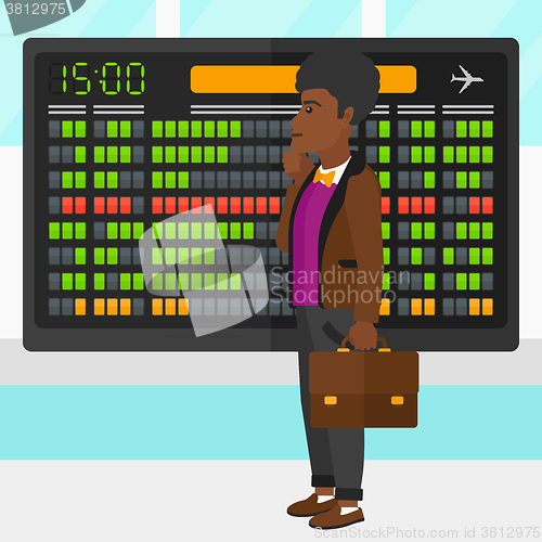 Image of Man looking at schedule board.