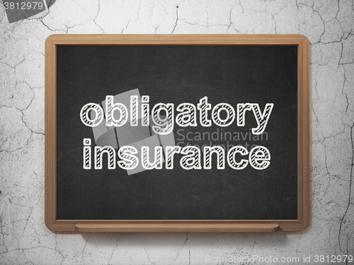 Image of Insurance concept: Obligatory Insurance on chalkboard background