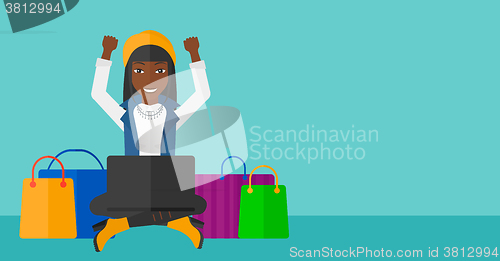 Image of Woman making purchases online.