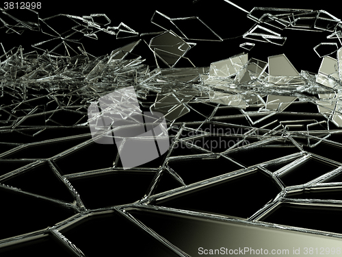 Image of Broken and cracked glass on black