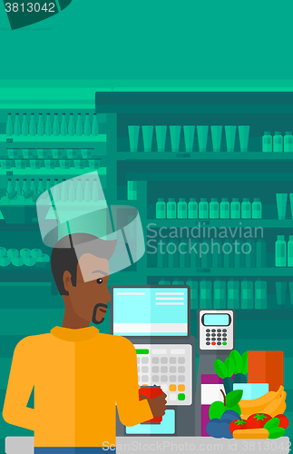 Image of Cashier at supermarket checkout.