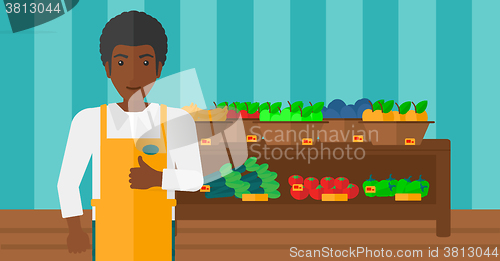 Image of Friendly supermarket worker.