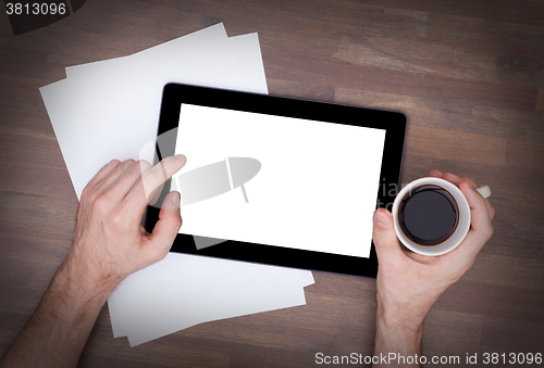 Image of Tablet touch computer gadget on wooden table