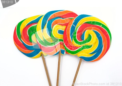 Image of three lollipops on white background