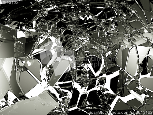 Image of Sharp Pieces of shattered black glass on white