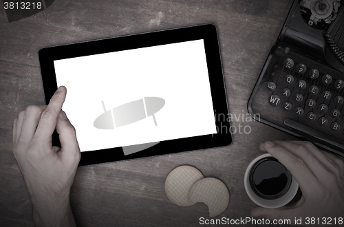 Image of Tablet touch computer gadget on wooden table