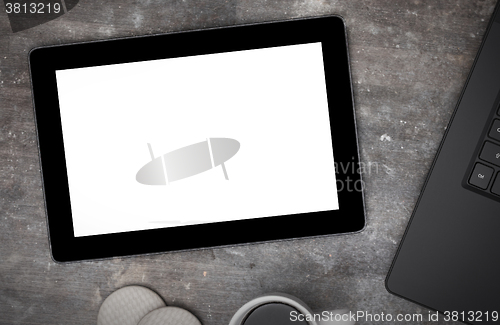 Image of Tablet touch computer gadget on wooden table