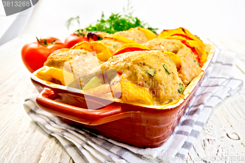 Image of Cutlets of turkey with tomatoes in pan on board