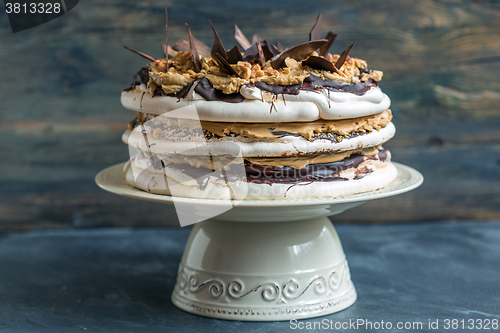 Image of Cake of meringue, cream with coffee and chocolate.