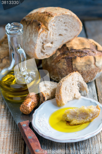 Image of Plate with olive oil and homemade bread.