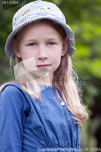 Image of little girl in blue hat